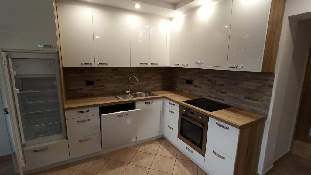 Kuchyň nebo kuchyňský kout v ubytování Apartma Apollonio
