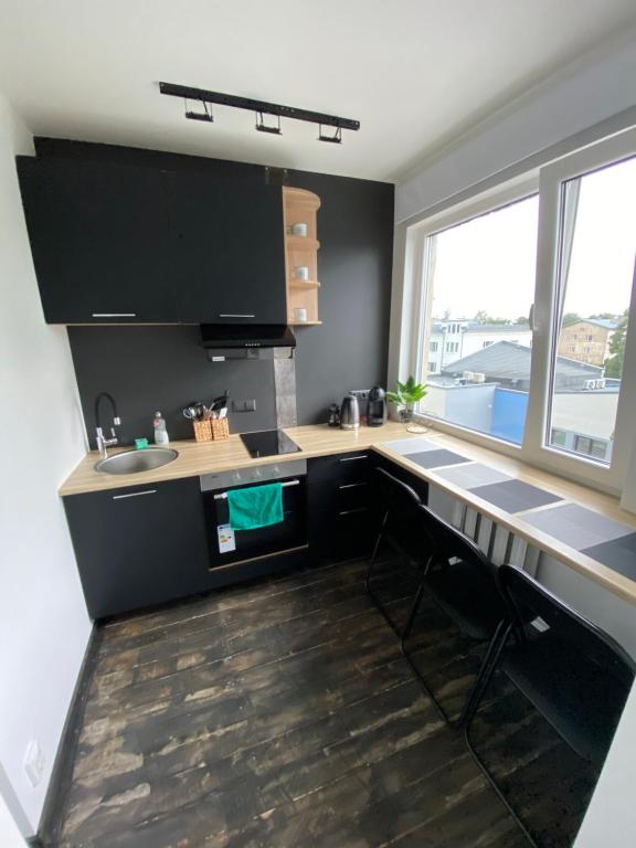 Kuchyň nebo kuchyňský kout v ubytování Apartments24 Laada 4