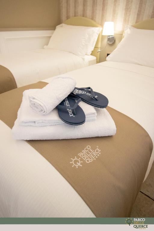 Postel nebo postele na pokoji v ubytování Hotel Parco delle Querce