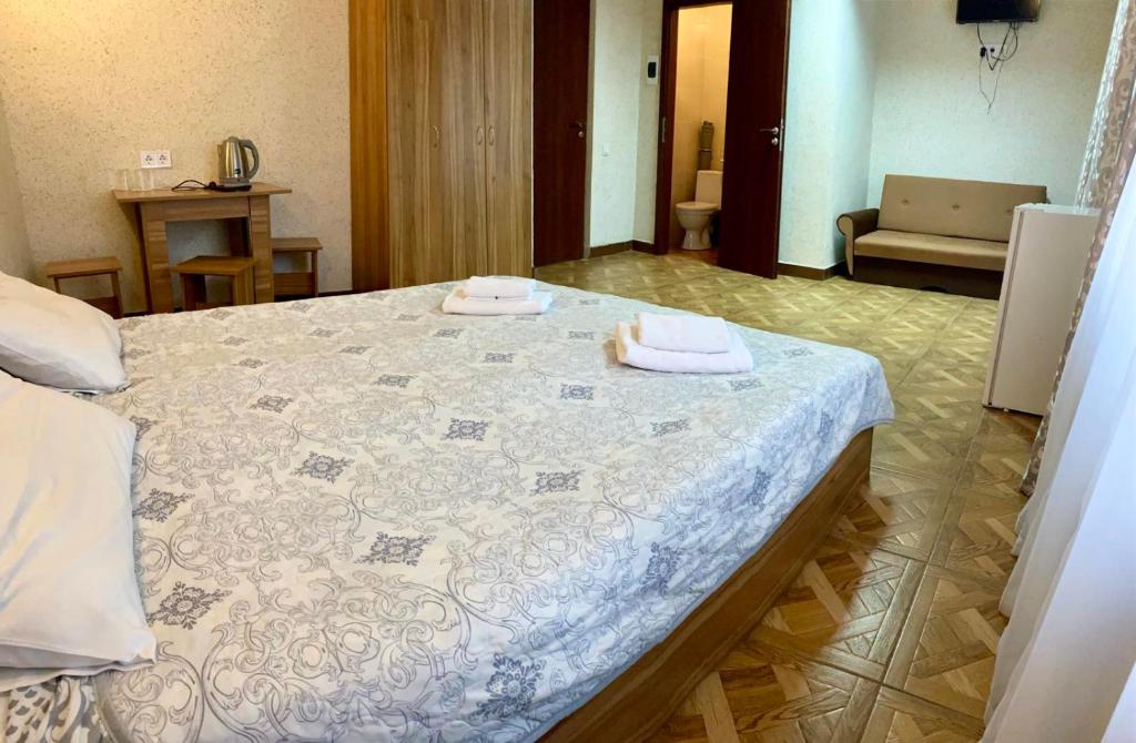 Postel nebo postele na pokoji v ubytování Zelenyi Kampus
