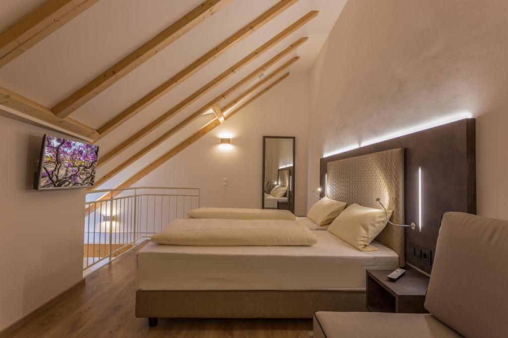 Postel nebo postele na pokoji v ubytování Hotel-Jakobslust