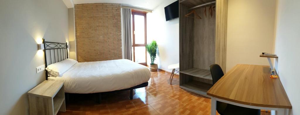Postel nebo postele na pokoji v ubytování B&B La Atalaya