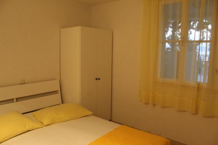 Posteľ alebo postele v izbe v ubytovaní Apartment Podgora (134-1)