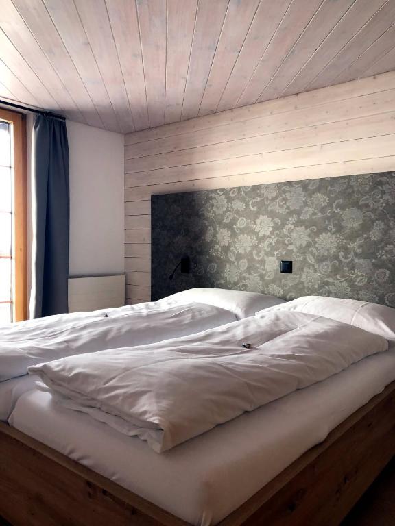 Postel nebo postele na pokoji v ubytování Hotel Aletsch