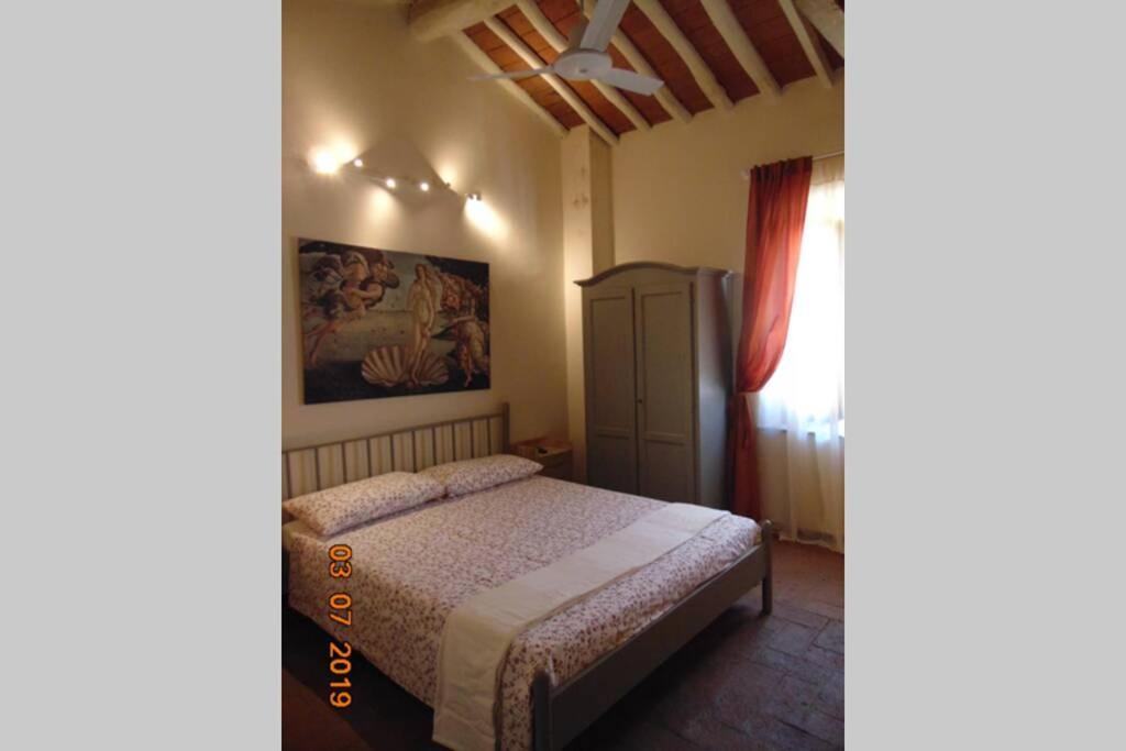 Posteľ alebo postele v izbe v ubytovaní Appartamento I Pini