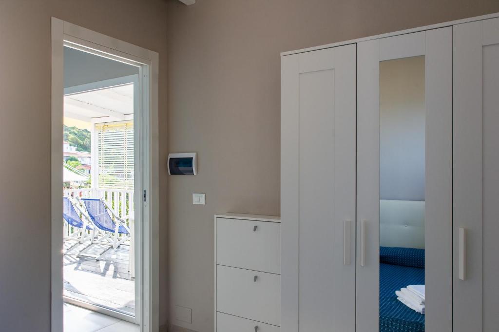 Postel nebo postele na pokoji v ubytování Resort Baia del Silenzio
