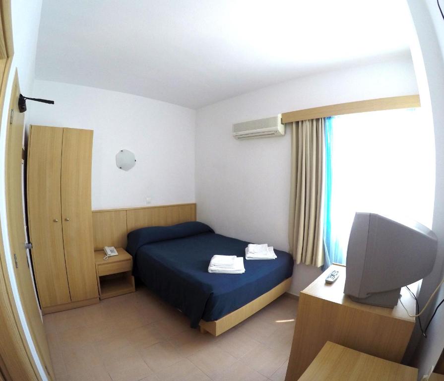 Łóżko lub łóżka w pokoju w obiekcie Europa Hotel