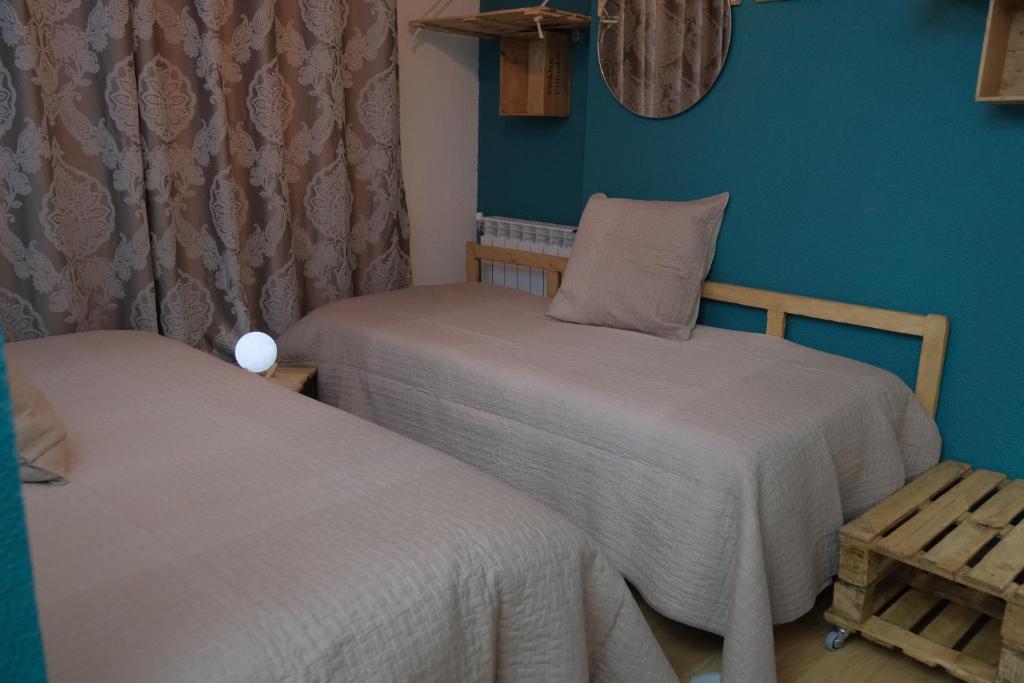 Postel nebo postele na pokoji v ubytování Hotel Arbre De Neu