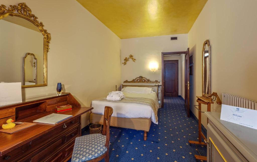 Łóżko lub łóżka w pokoju w obiekcie Abano Ritz Hotel Terme