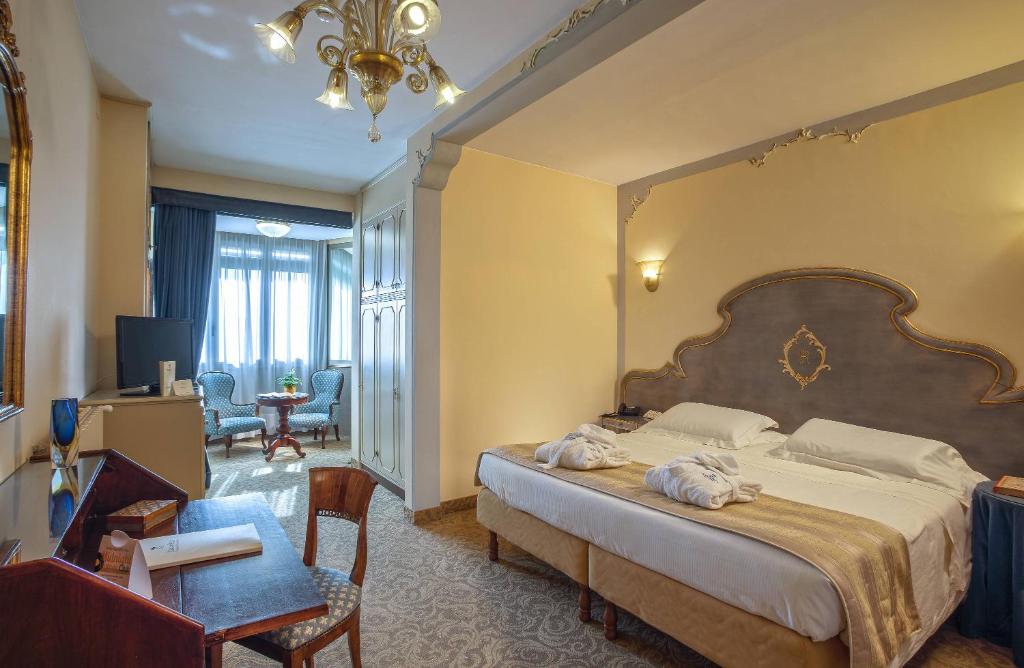 Łóżko lub łóżka w pokoju w obiekcie Abano Ritz Hotel Terme
