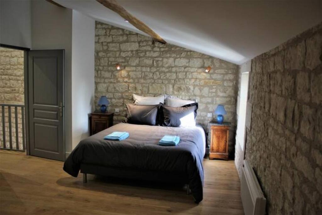Posteľ alebo postele v izbe v ubytovaní Château des Loups - Les Cèdres Bleus