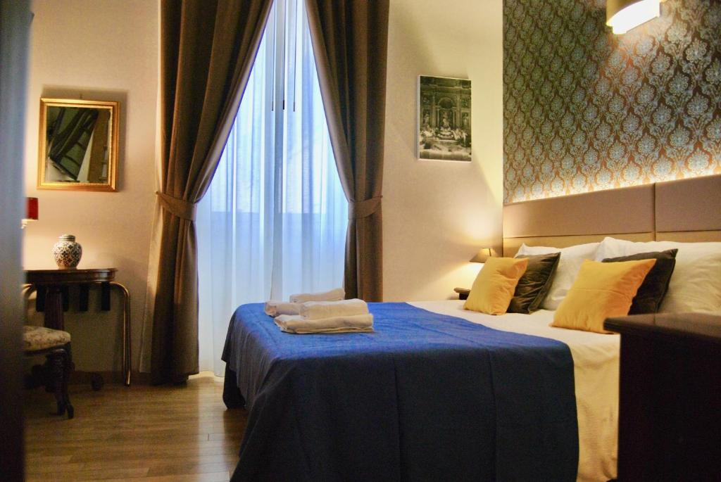 Posteľ alebo postele v izbe v ubytovaní Navona Residenza de Charme