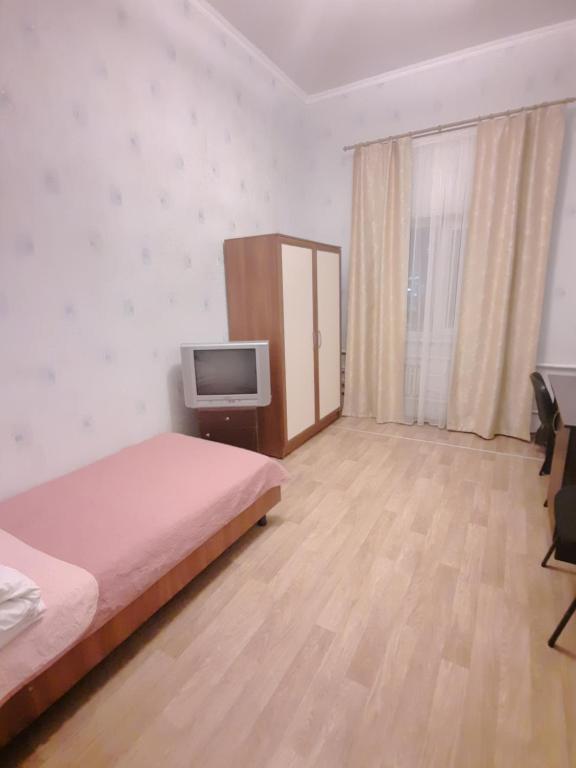 Postel nebo postele na pokoji v ubytování Hotel Aleksandria