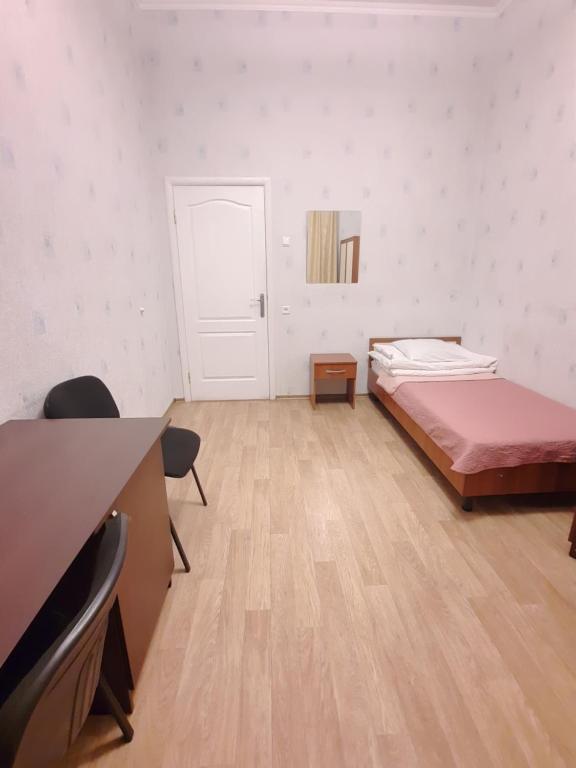 Postel nebo postele na pokoji v ubytování Hotel Aleksandria