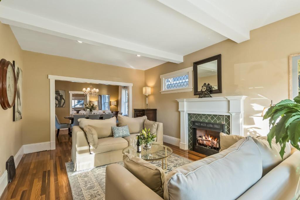a living room with a couch and a fireplace at Dreamy Abode in Spokane