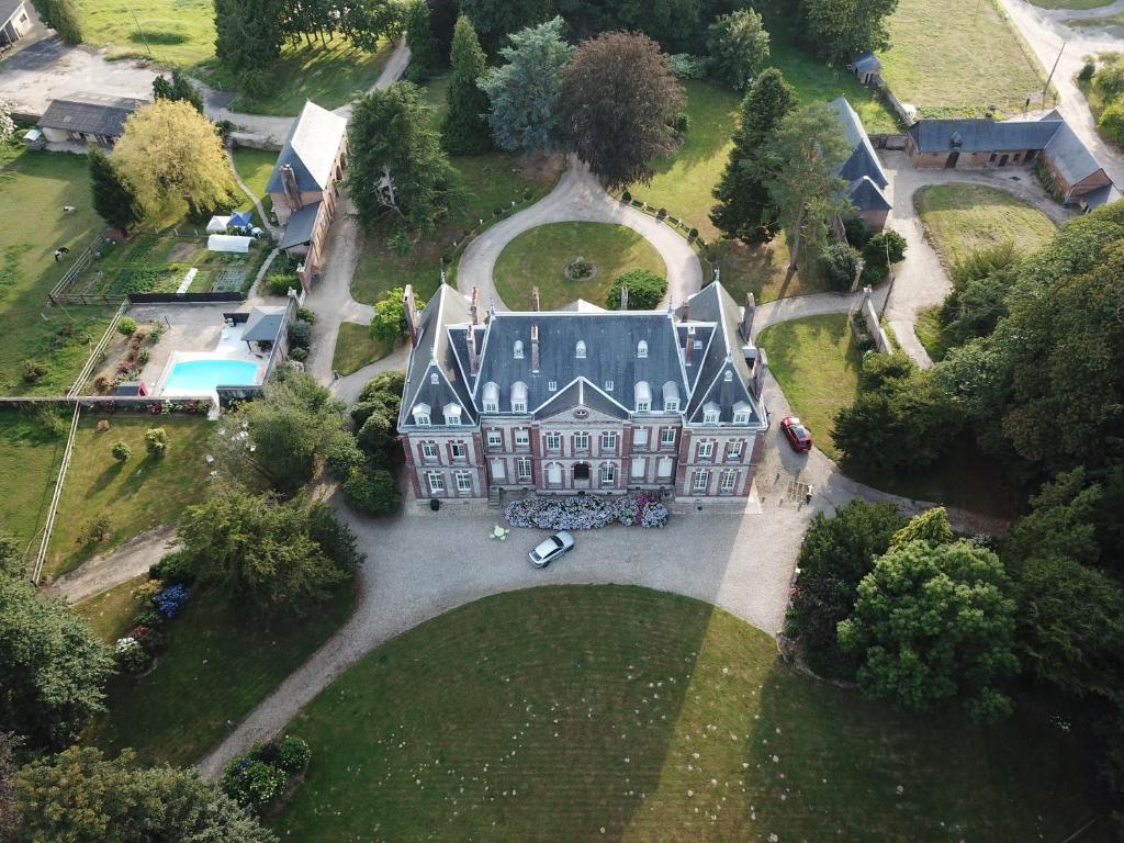 an aerial view of a large house with a yard at CHATEAU D HUGLEVILLE in Hugleville-en-Caux