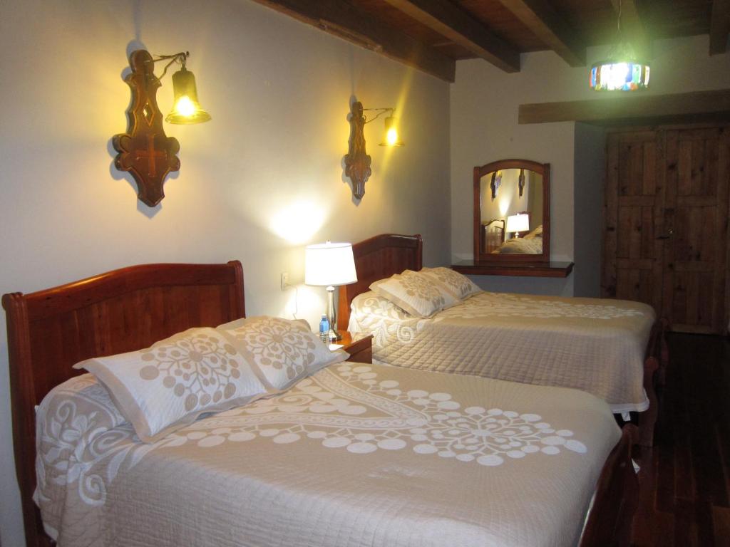 Postel nebo postele na pokoji v ubytování Hotel Santa Clara