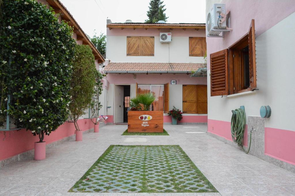 a house with a walkway leading to the front door at Complejo Solar Apart in Villa Regina