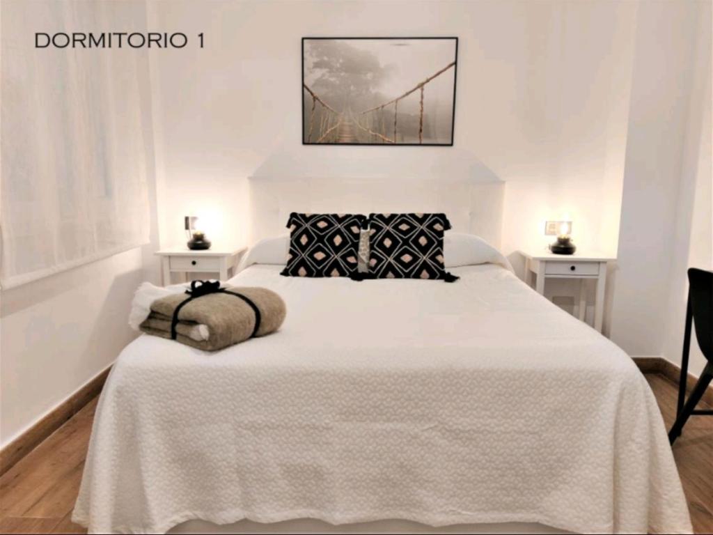 Postel nebo postele na pokoji v ubytování Suite Haus Vargas