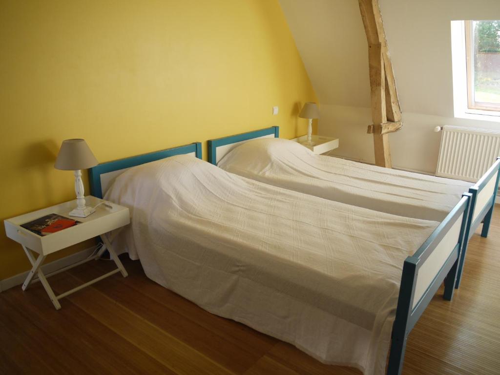 Postel nebo postele na pokoji v ubytování Gîte de la Ferme Rose