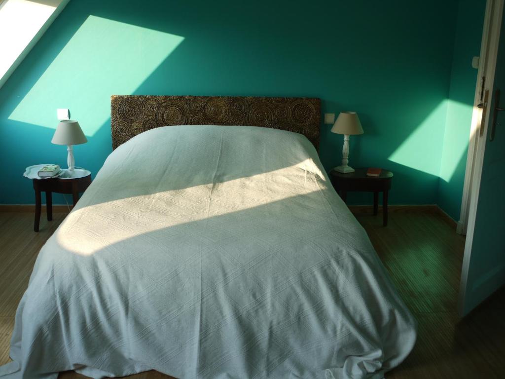 Postel nebo postele na pokoji v ubytování Gîte de la Ferme Rose