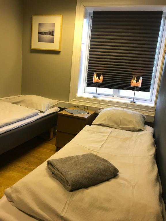 Postel nebo postele na pokoji v ubytování Taras Rom og leiligheter
