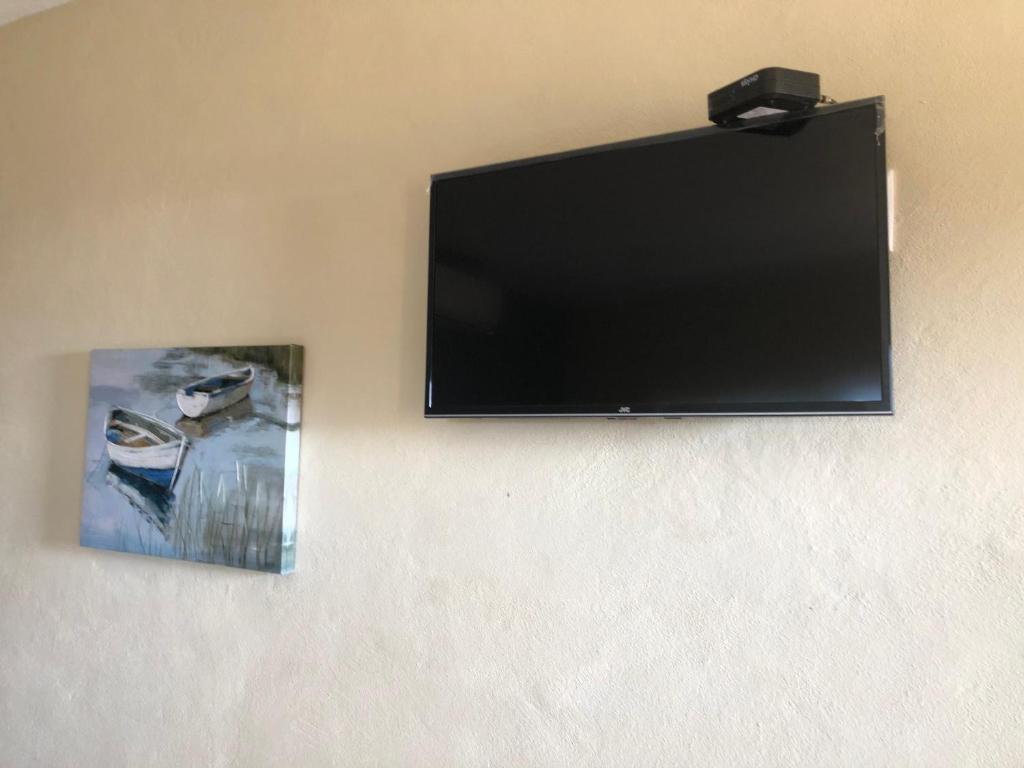 TV a/nebo společenská místnost v ubytování Brisa Bliss