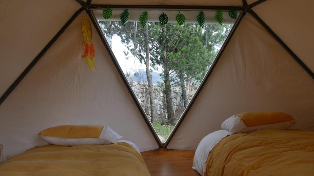 Postel nebo postele na pokoji v ubytování Domos Cordillera Blanca