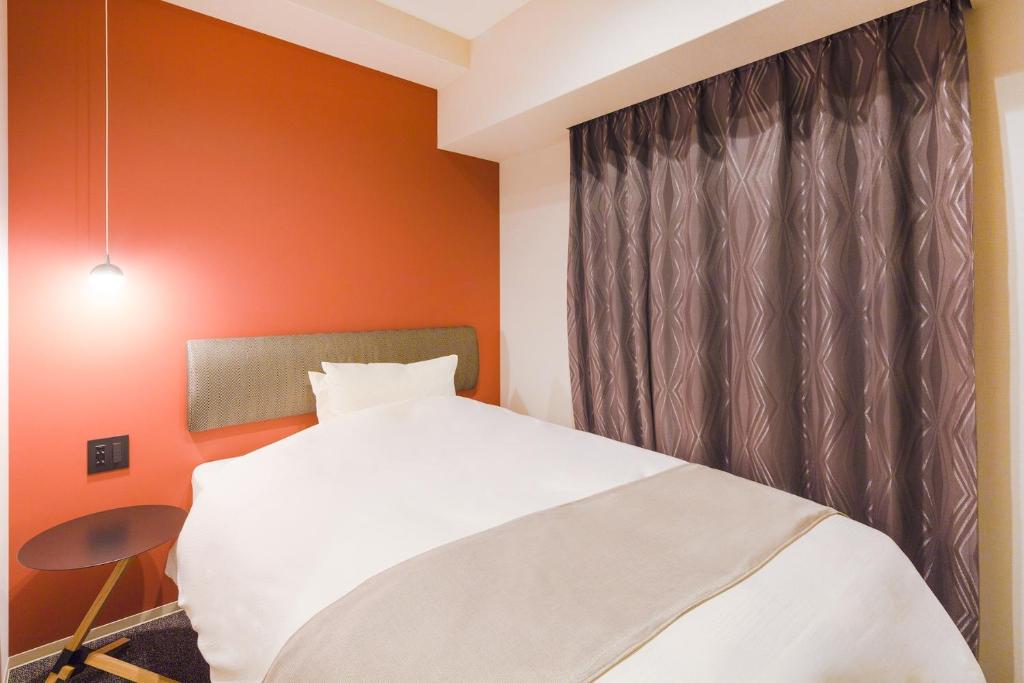 Postel nebo postele na pokoji v ubytování Hotel M's Est Shijo Karasuma