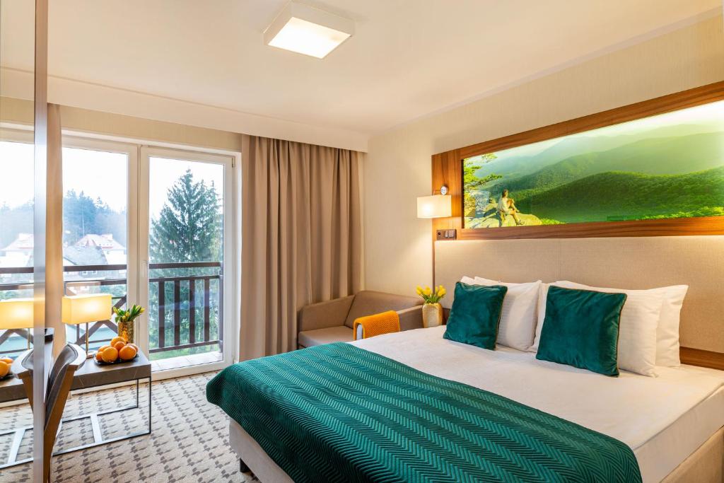 Posteľ alebo postele v izbe v ubytovaní Hotel Verde Montana Wellness & Spa
