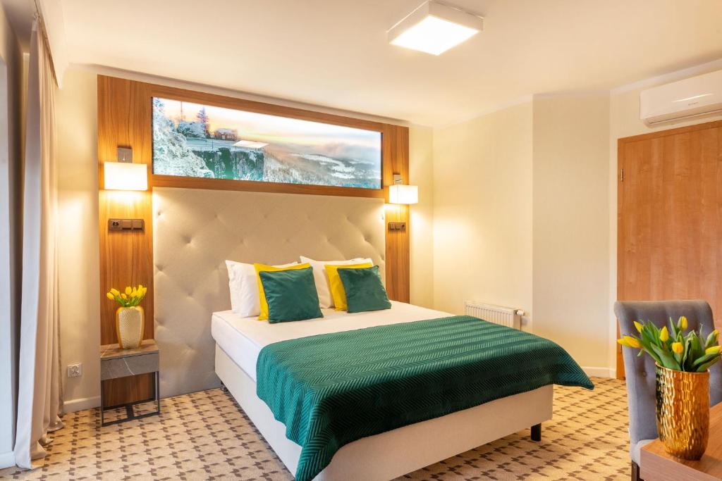 Posteľ alebo postele v izbe v ubytovaní Hotel Verde Montana Wellness & Spa