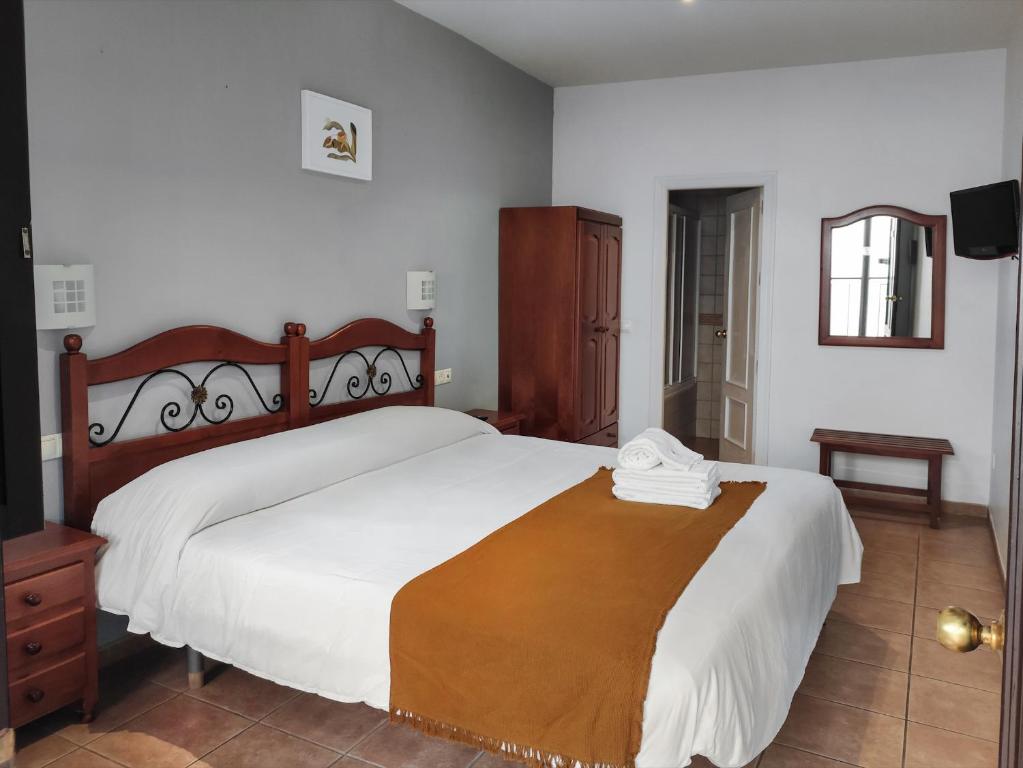 Posteľ alebo postele v izbe v ubytovaní La Piquera Hostal