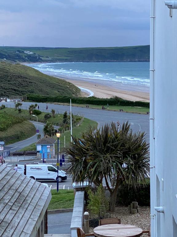 a view of the beach from the balcony of a house at Southover Beach in Woolacombe