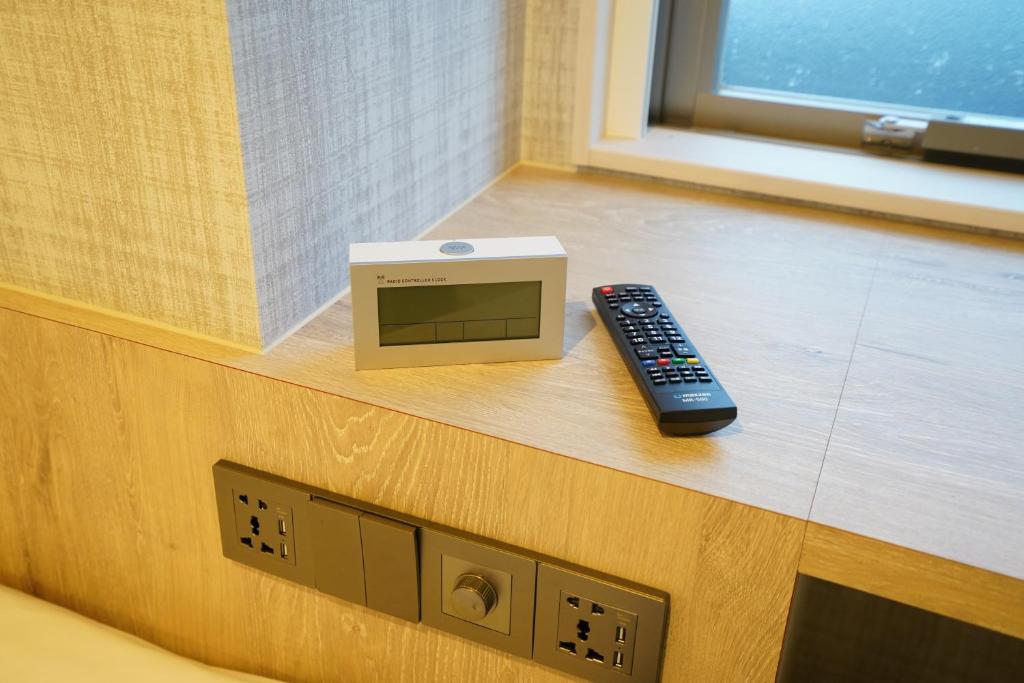 TV a/nebo společenská místnost v ubytování Plaza In Kanku Hotel