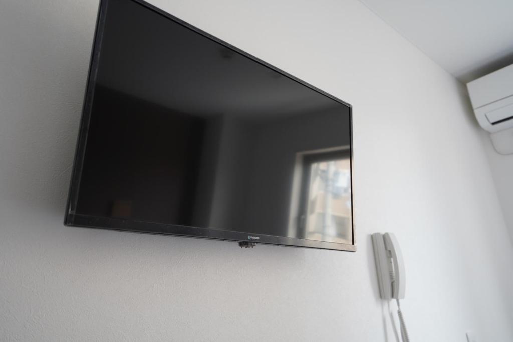 TV a/nebo společenská místnost v ubytování Plaza In Kanku Hotel