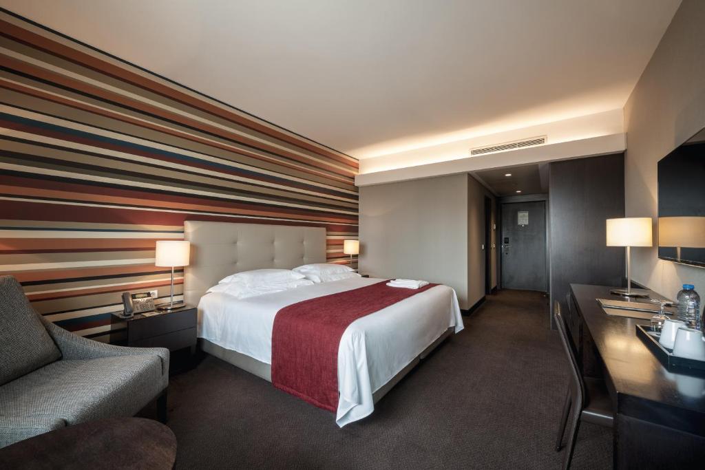 Voodi või voodid majutusasutuse Hotel Trópico toas