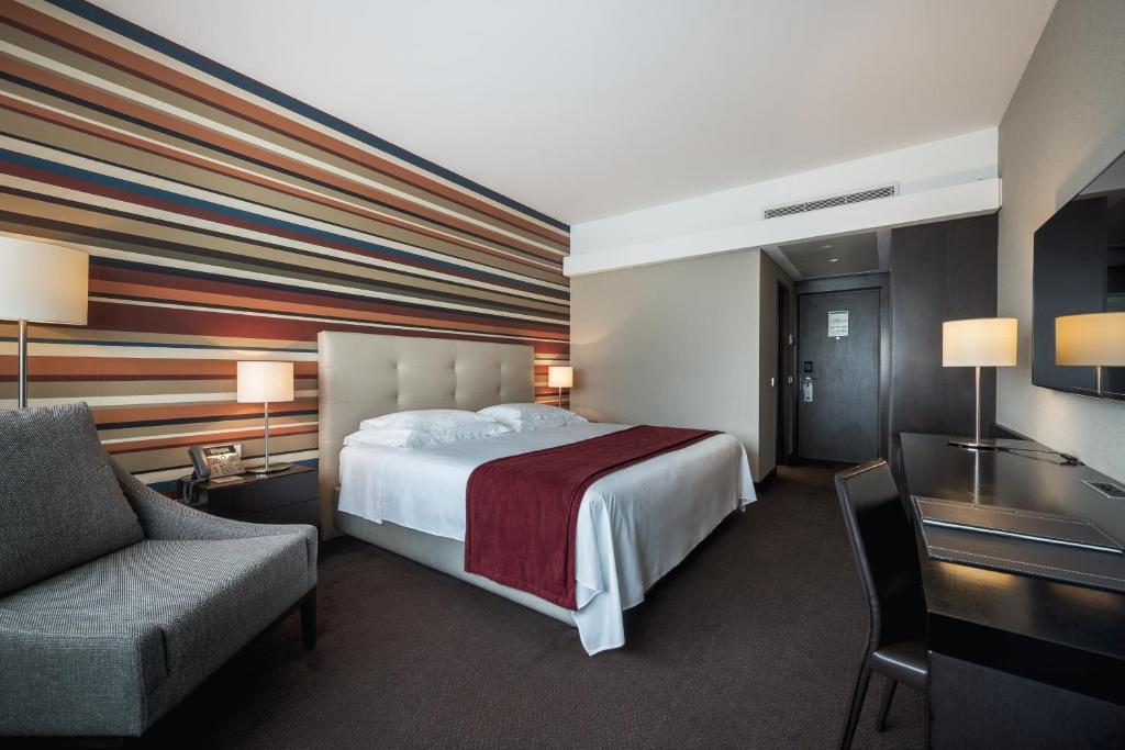 Voodi või voodid majutusasutuse Hotel Trópico toas