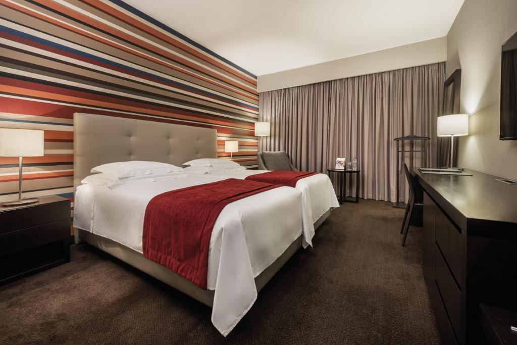 Voodi või voodid majutusasutuse Hotel Trópico toas