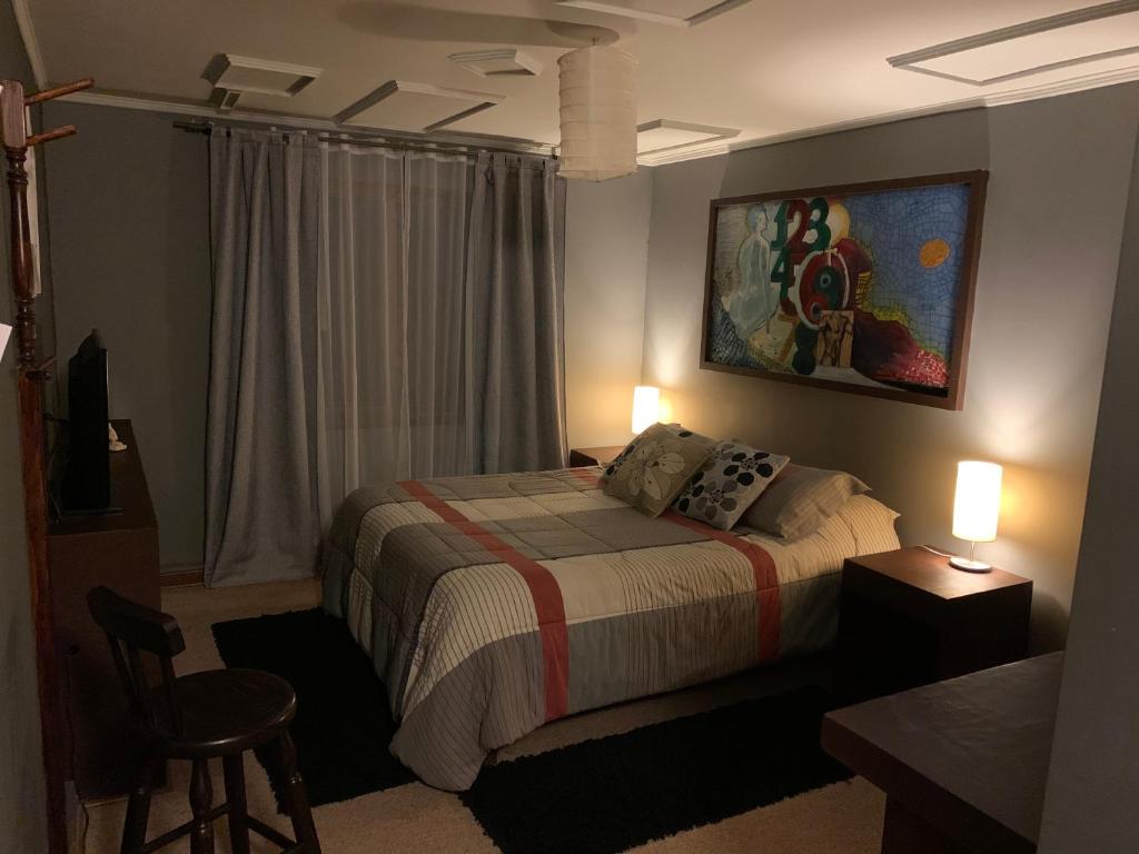 Postel nebo postele na pokoji v ubytování Hostal Boutique 180 Grados