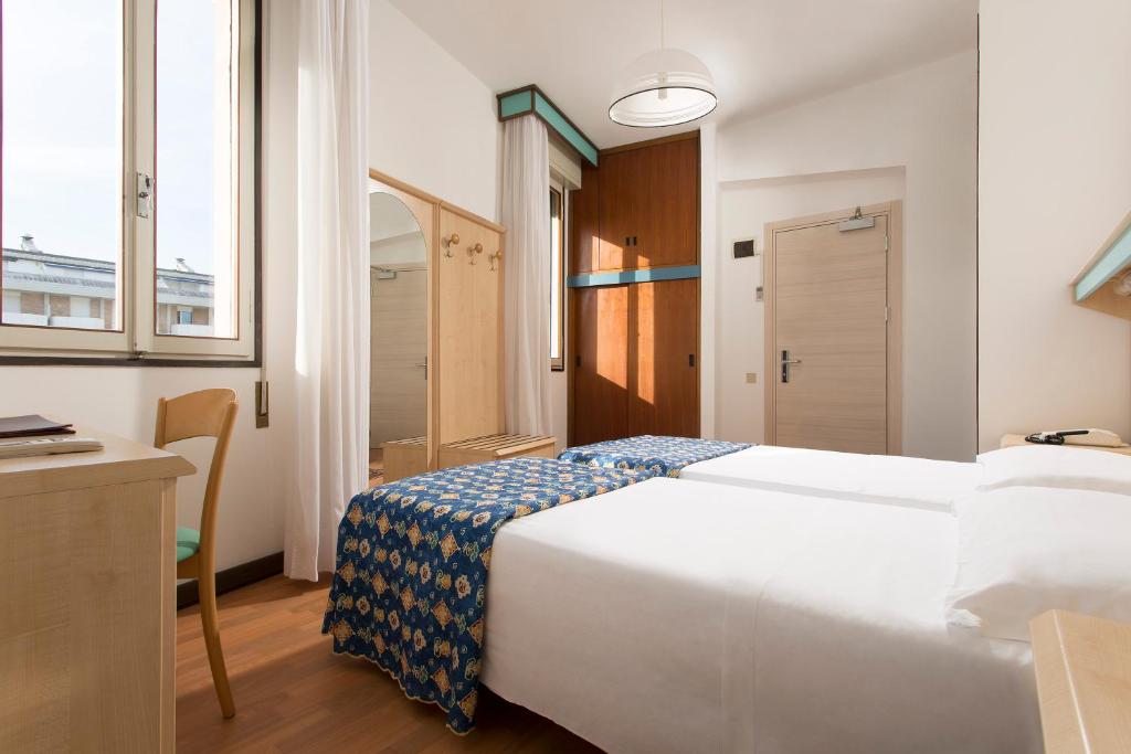 Postel nebo postele na pokoji v ubytování Hotel Las Vegas