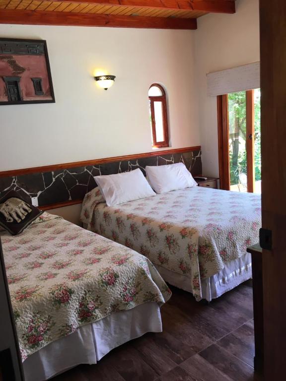 Postel nebo postele na pokoji v ubytování Hostal Puritama