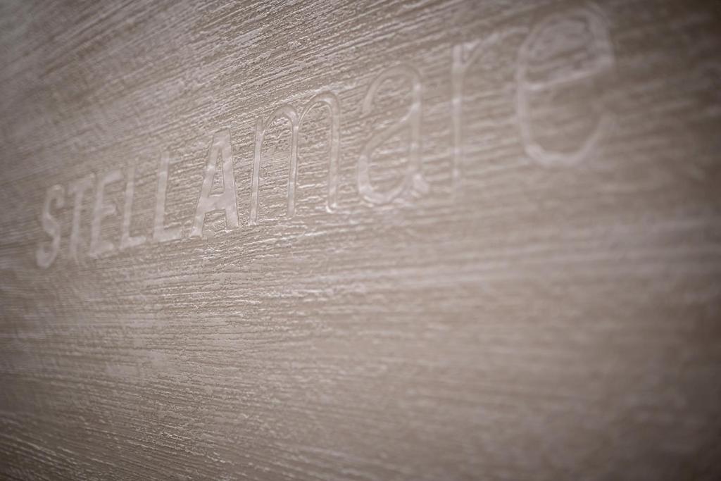 a close up of a wooden object with writing on it at Stellamare in Caorle