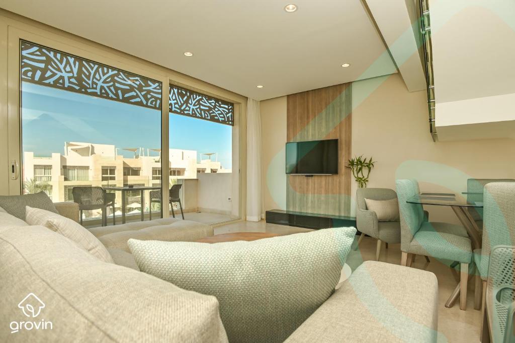 TV a/nebo společenská místnost v ubytování Mangroovy Residence El Gouna - Grovin