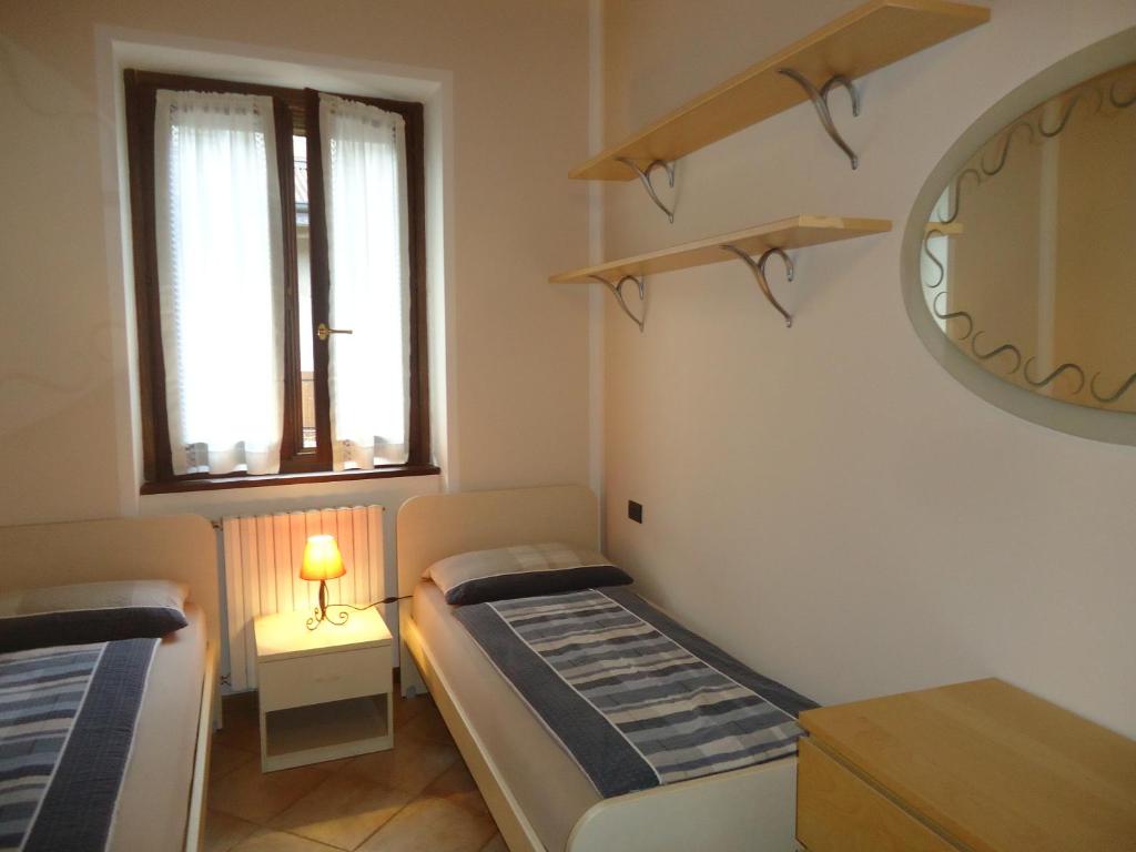 Postel nebo postele na pokoji v ubytování Casa Vittoria V1
