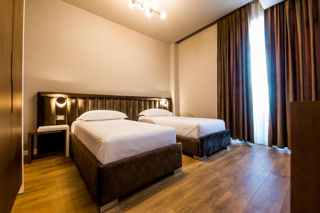 Postel nebo postele na pokoji v ubytování Hotel Bonsai