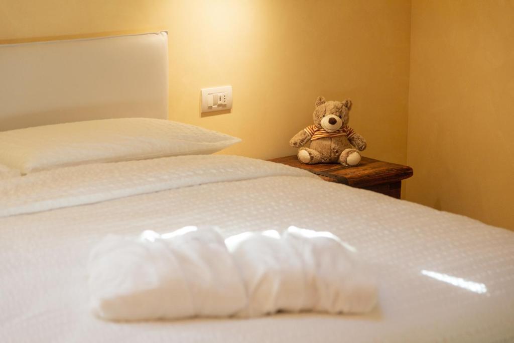 Postel nebo postele na pokoji v ubytování Borgo Cantagallo Casa Ofelia