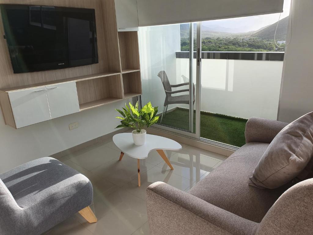 Posezení v ubytování Excelente Apartamento Completo, en la mejor zona
