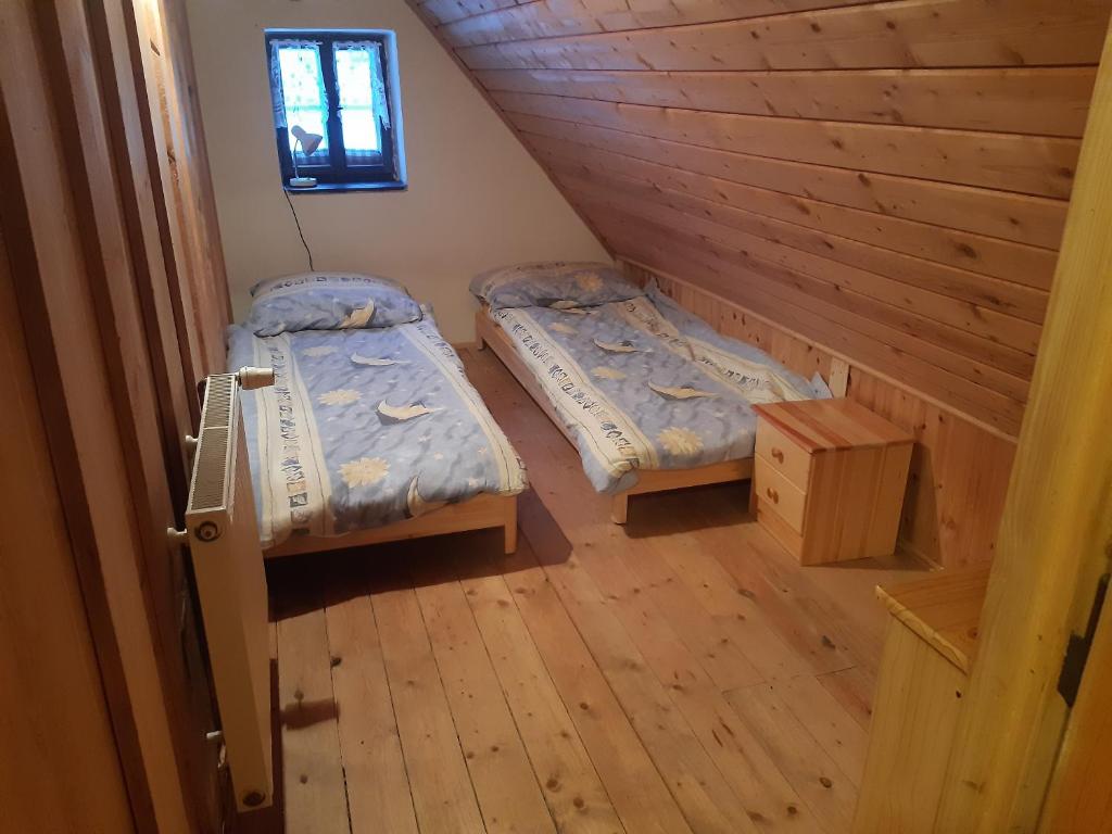 Postel nebo postele na pokoji v ubytování Chalupa Paseky