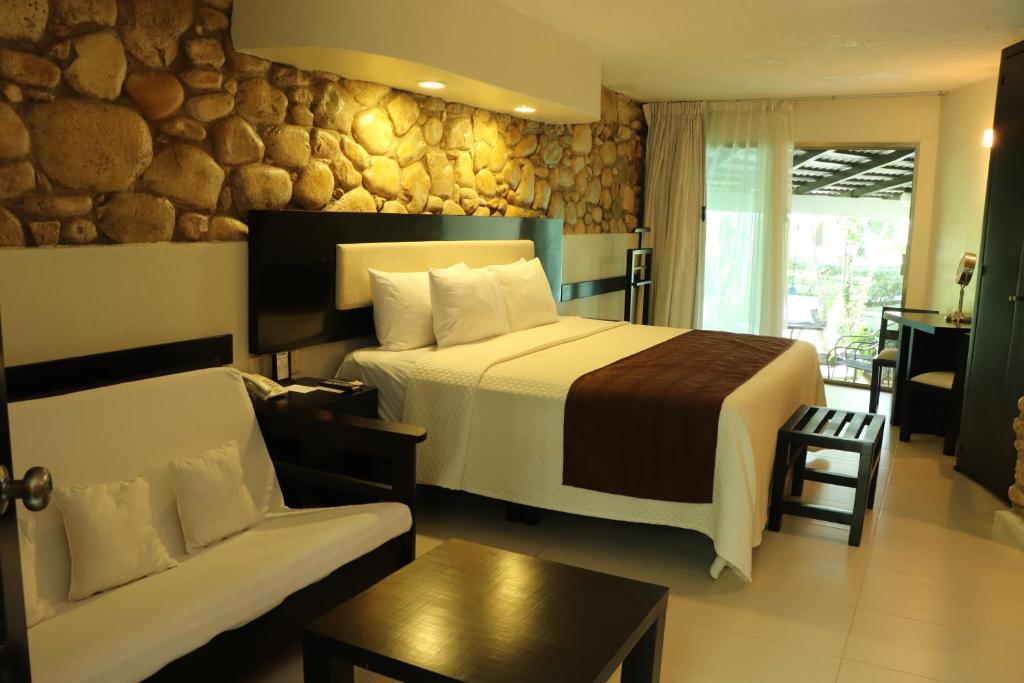 Postel nebo postele na pokoji v ubytování Hotel Nututun Palenque
