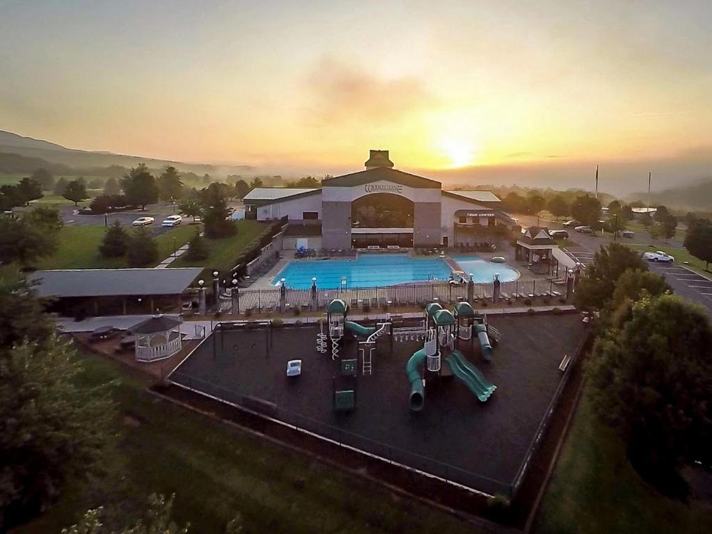 an overhead view of a large swimming pool with a building at Mountainside Villas at Massanutten by TripForth in McGaheysville